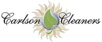 Carlson Cleaners logo featuring a green leaf inside a blue circle, surrounded by tan sun-like rays, with the company name in script font on either side.